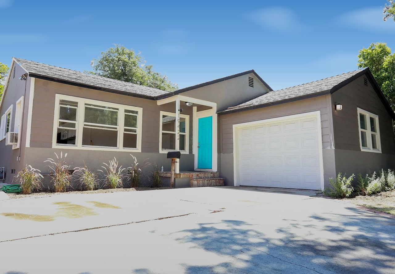 19422 Archwood St: gray single-story house with a turquoise front door